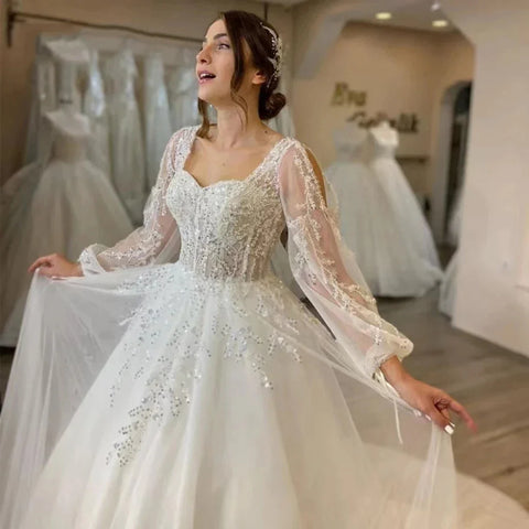 Wunderschöne flauschige lange Ärmel Spitzenapplikationen quadratischer Ausschnitt Mopping Brautkleider weiß faszinierende elegante Brautkleider Frauen