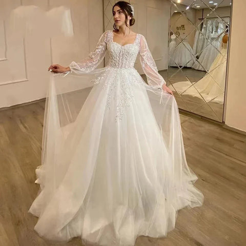 Wunderschöne flauschige lange Ärmel Spitzenapplikationen quadratischer Ausschnitt Mopping Brautkleider weiß faszinierende elegante Brautkleider Frauen