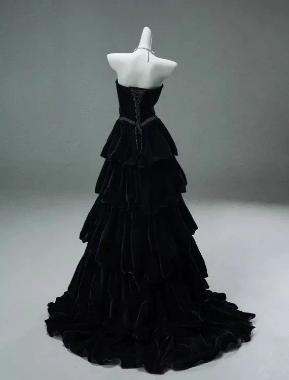 Black tiered evening gown on mannequin, ZAPDRESS formal fashion style
