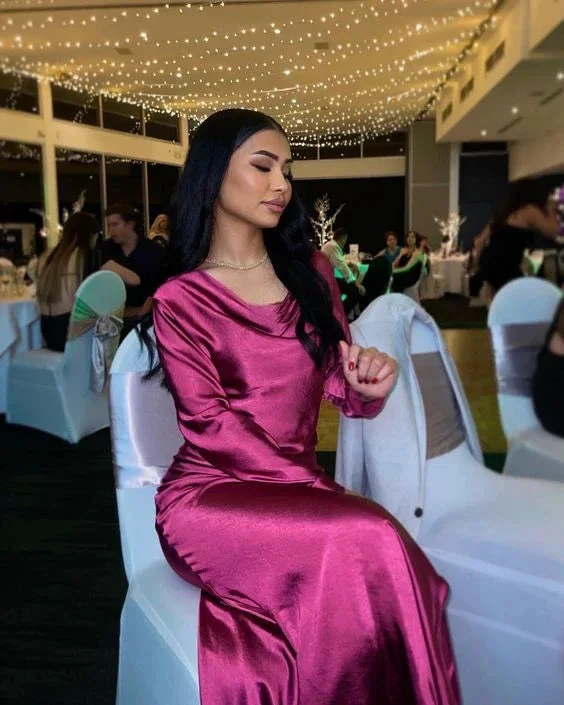 Woman in elegant magenta satin dress at formal event, ZAPDRESS evening fashion