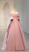 Elegant pink off-shoulder ball gown with black ribbon by ZAPDRESS on display in a bright room