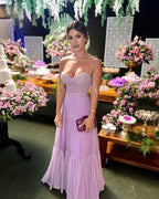 Woman in lilac evening dress at elegant floral event, ZAPDRESS fashion inspiration