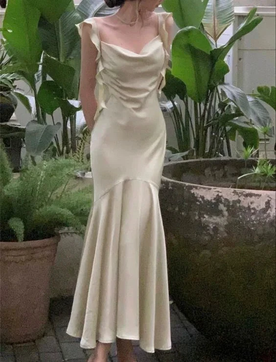 Elegant woman in light yellow satin evening dress with ruffle sleeves, ZAPDRESS fashion