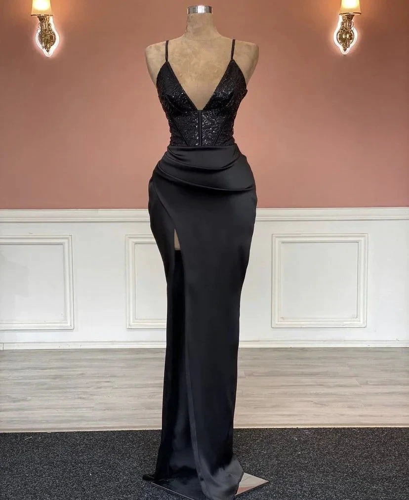 Elegant black evening gown with sequin bodice and thigh-high slit on mannequin, ZAPDRESS