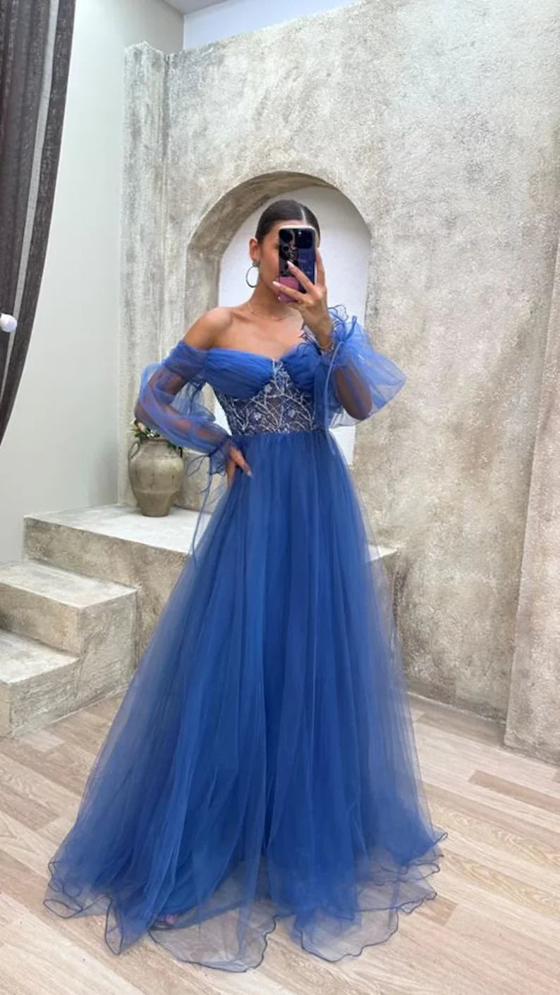 Woman in blue off-shoulder evening gown with tulle and sequin details, ZAPDRESS style