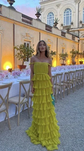 Woman in off-shoulder yellow ruffled evening dress at elegant outdoor dinner, ZAPDRESS