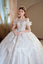 Vestido de gala de tul con escote en forma de corazón, brillante, color marfil, con mangas con volantes, bordado de perlas y cola de encaje M013