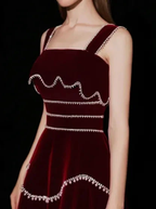 Elegant burgundy velvet dress with silver trim, sleeveless, featured on ZAPDRESS homepage
