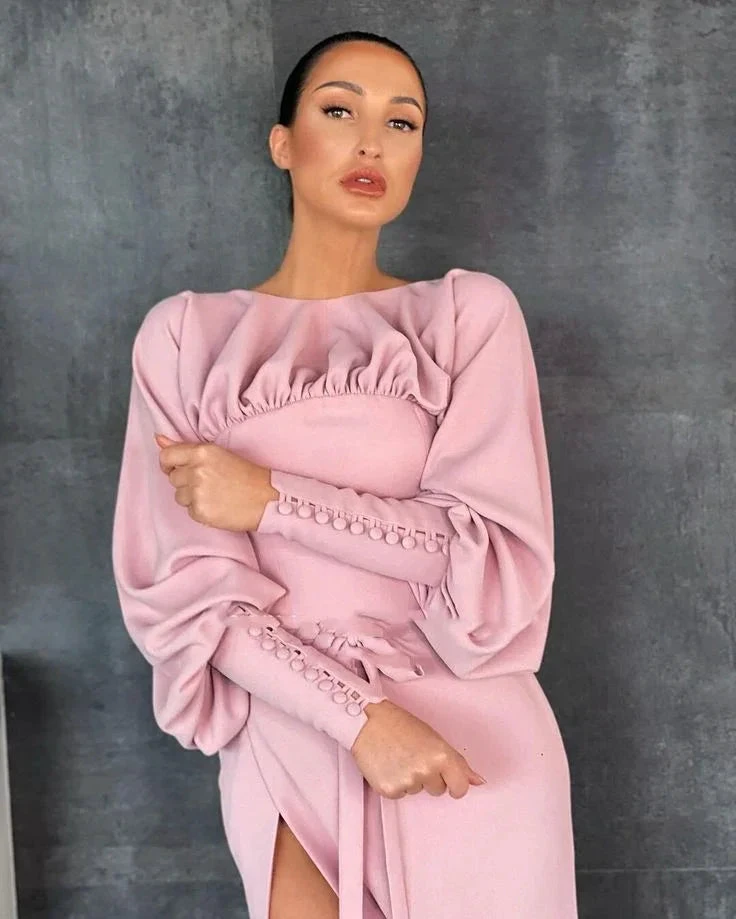 Woman in elegant light pink ruched dress with long puffed sleeves, Zapdress style