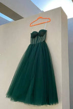 Elegant dark green tulle strapless dress on hanger, ZAPDRESS fashion product
