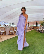 Woman in lilac one-shoulder dress at elegant outdoor event, ZAPDRESS fashion style