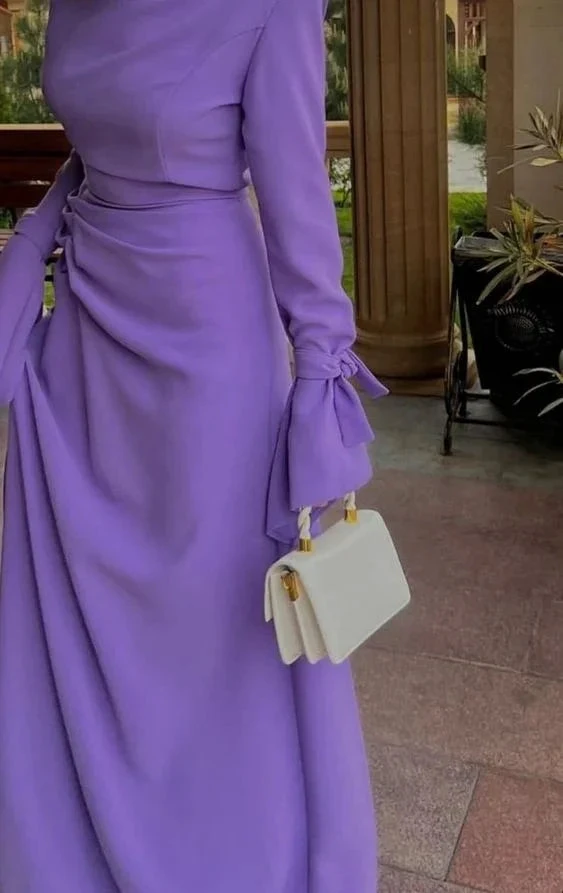 Woman in long-sleeve lavender dress holding white handbag, elegant style at ZAPDRESS