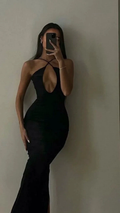 Woman in a black cut-out evening dress posing for mirror selfie, ZAPDRESS fashion