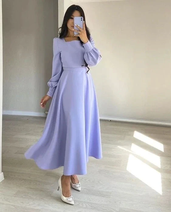 Woman in a long light purple dress with long sleeves posing indoors, ZAPDRESS fashion