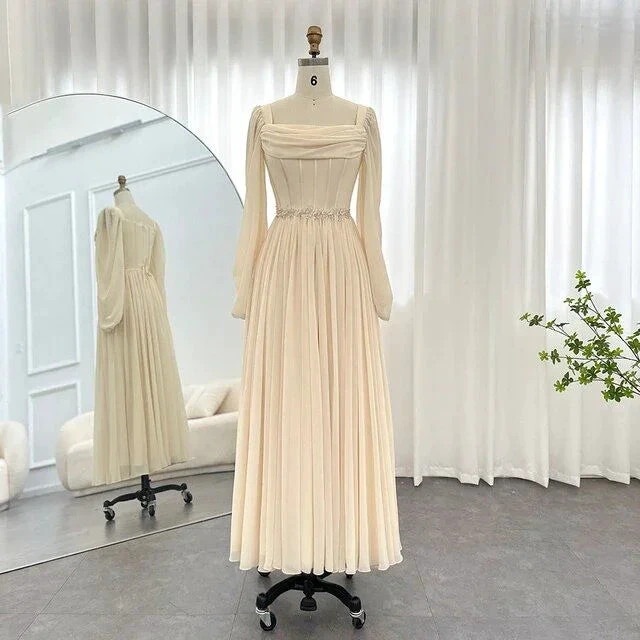 Elegant cream long sleeve pleated maxi dress on mannequin in bright modern room, ZAPDRESS