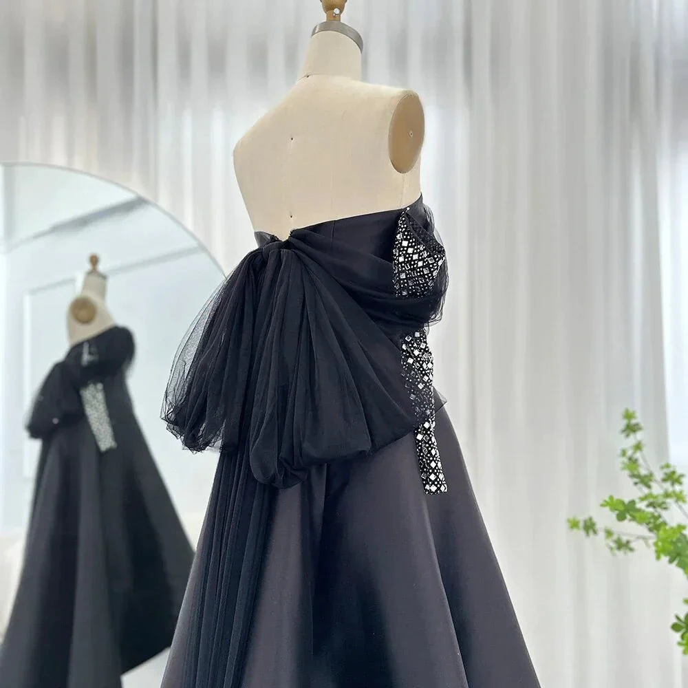 Elegant black strapless gown with tulle accents on mannequin, ZAPDRESS fashion display