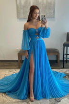 Woman taking mirror selfie in off-shoulder blue formal dress with high slit at ZAPDRESS