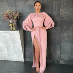 Woman in a pink long-sleeve ruffle dress with leg slit, posing indoors, ZAPDRESS fashion