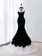 ZAPDRESS black mermaid gown with halter neck and white tulle hem on mannequin