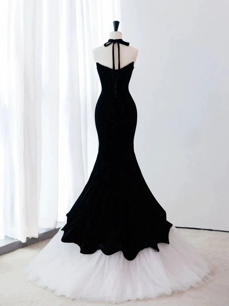 ZAPDRESS black mermaid gown with halter neck and white tulle hem on mannequin