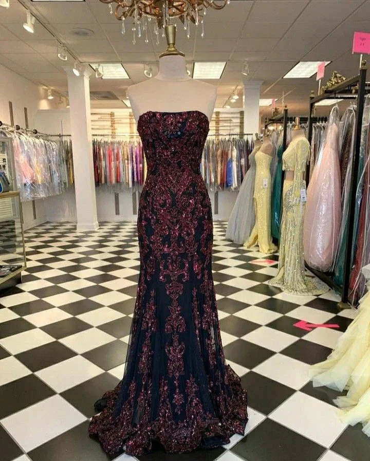 Strapless black and burgundy embroidered evening gown on mannequin in ZAPDRESS formal dress boutique