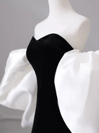 Elegant black dress with dramatic white puff sleeves on mannequin, ZAPDRESS fashion