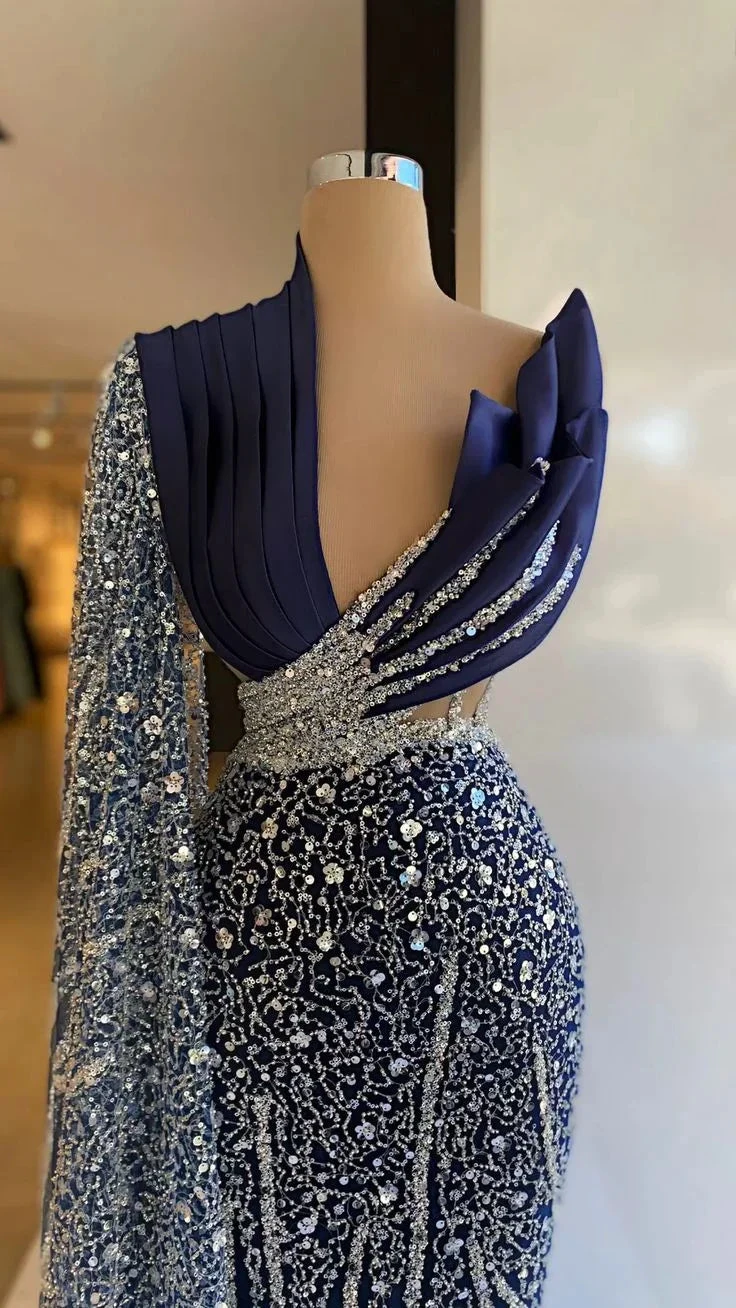 Elegant navy blue evening gown with sparkling silver embellishments on display at ZAPDRESS
