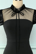 Black dress from ZAPDRESS with lace mesh neckline and bow detail on mannequin