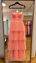 Pink tiered tulle dress on hanger in boutique, ZAPDRESS, elegant evening gown display