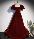 Elegant burgundy velvet evening gown with puff sleeves on mannequin, ZAPDRESS fashion