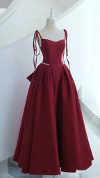 Elegant burgundy evening gown with pearl waist detail on mannequin, ZAPDRESS fashion