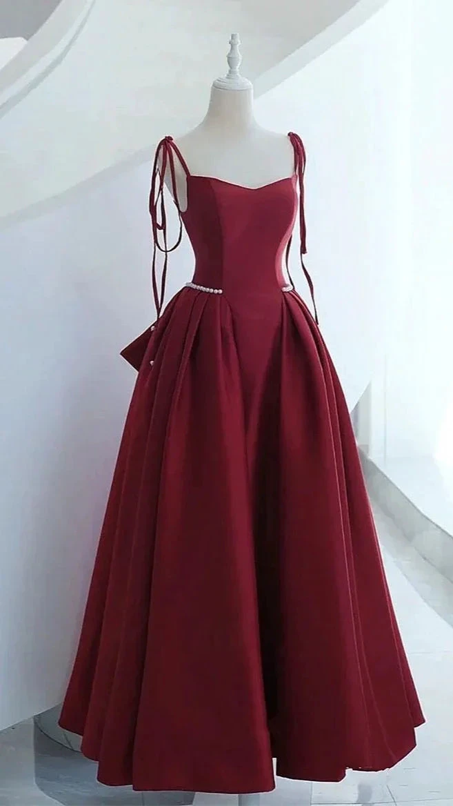Elegant burgundy evening gown with pearl waist detail on mannequin, ZAPDRESS fashion