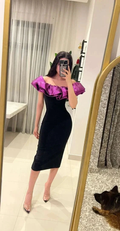 Woman wearing off-shoulder black dress with purple ruffle, ZAPDRESS fashion mirror selfie