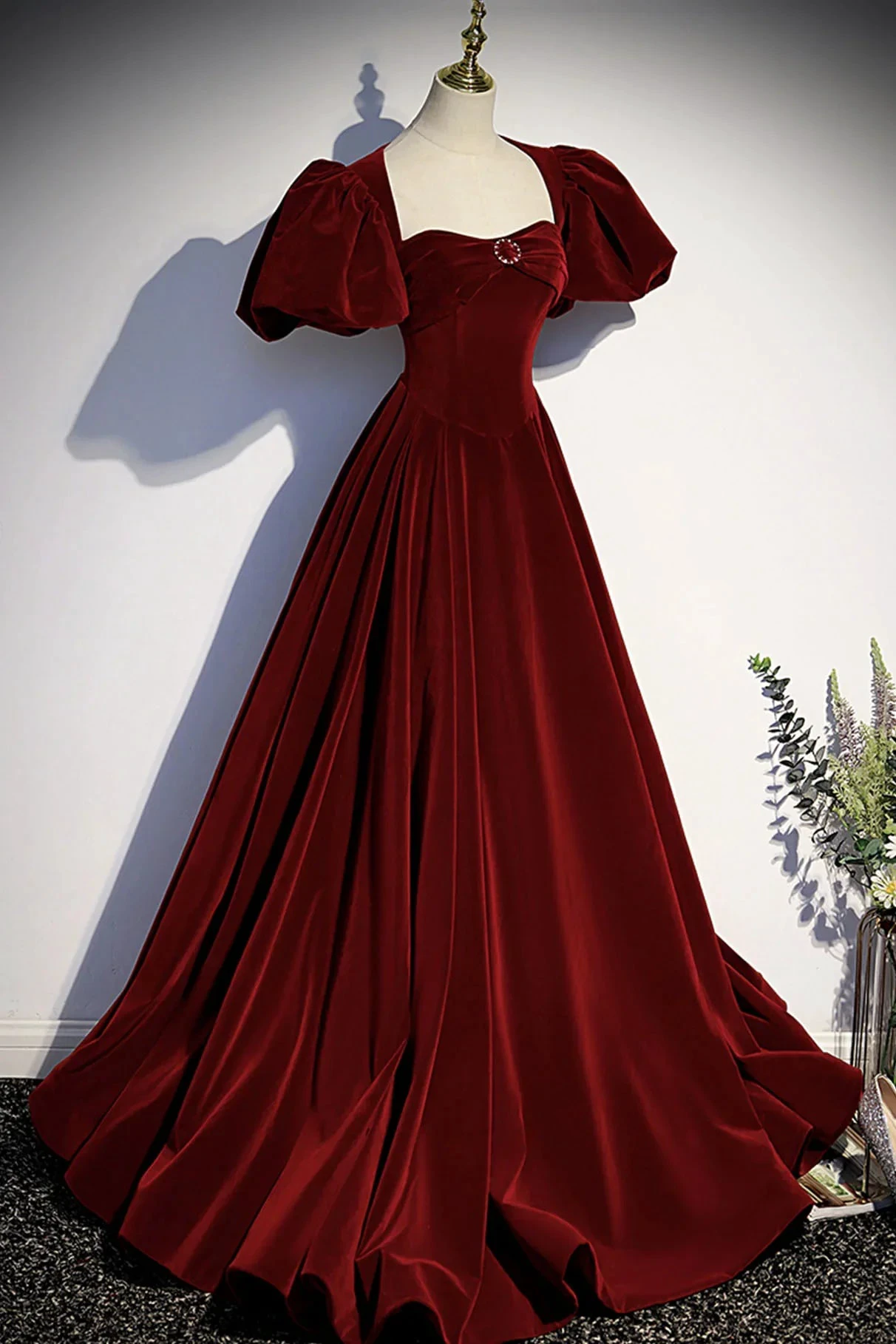 Elegant red velvet ball gown with puff sleeves on mannequin, ZAPDRESS fashion style