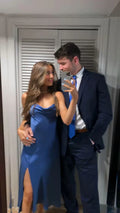 Couple in mirror selfie, woman in blue satin dress, man in navy suit with blue tie, ZAPDRESS