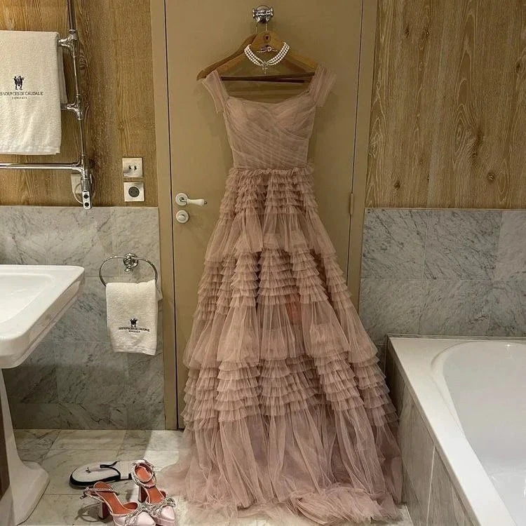 Elegant pink tiered tulle gown with pearls and matching heels in luxe bathroom, ZAPDRESS