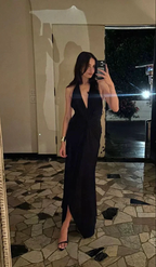 Woman in a black halter evening dress taking a mirror selfie, ZAPDRESS fashion style