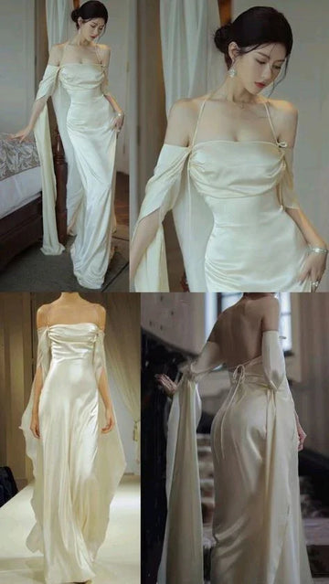 Elegant woman in ivory satin off-shoulder evening gown, ZAPDRESS fashion style.