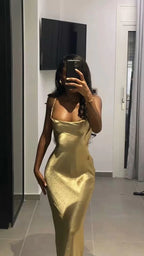 Woman in gold satin slip dress taking mirror selfie indoors, ZAPDRESS fashion