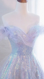 Iridescent off-shoulder sequin dress with tulle details displayed on mannequin at ZAPDRESS