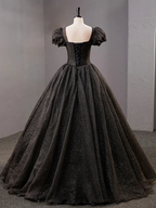 Elegant black ball gown with puff sleeves and lace-up back on mannequin at ZAPDRESS