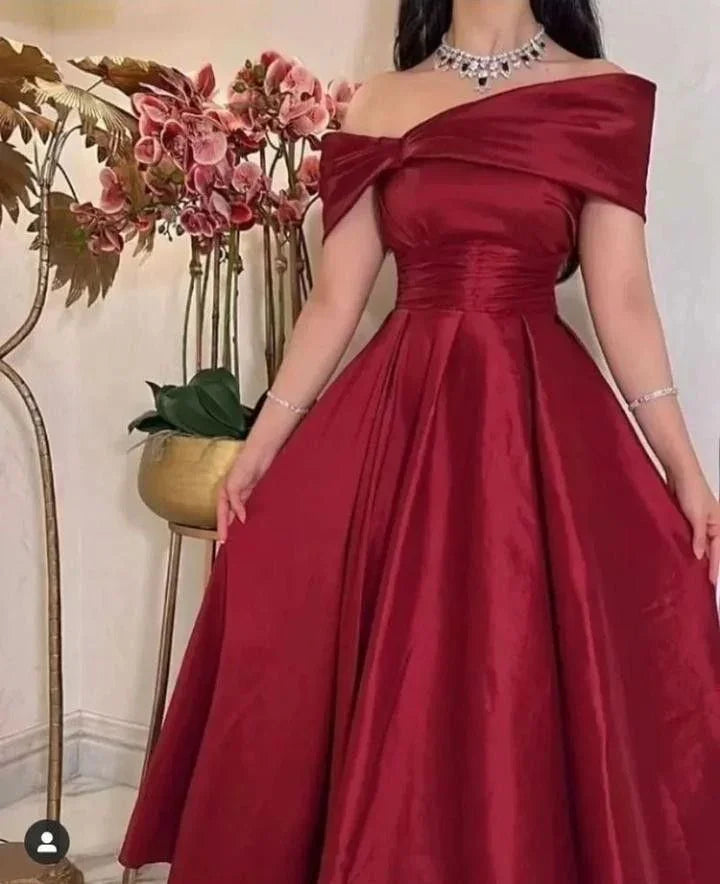 Elegant off-shoulder burgundy evening gown with pleated waist, featured on ZAPDRESS homepage