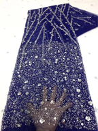 Navy blue sequin embroidered fabric with floral and geometric patterns, hand shown for texture