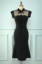 Elegant black cocktail dress with mesh neckline and fringe sleeves on mannequin, ZAPDRESS