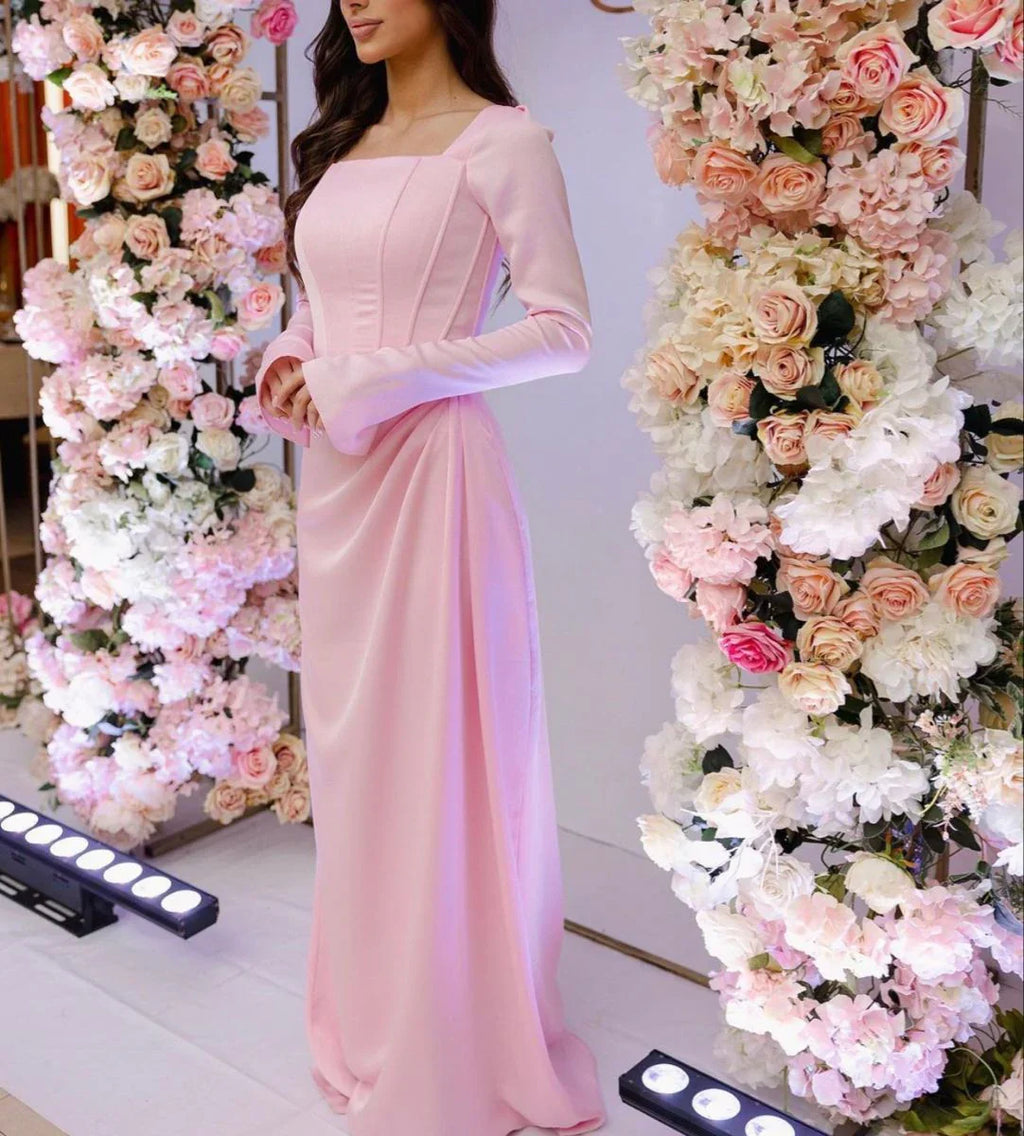 Woman in elegant pink long dress standing between floral arches, ZAPDRESS fashion