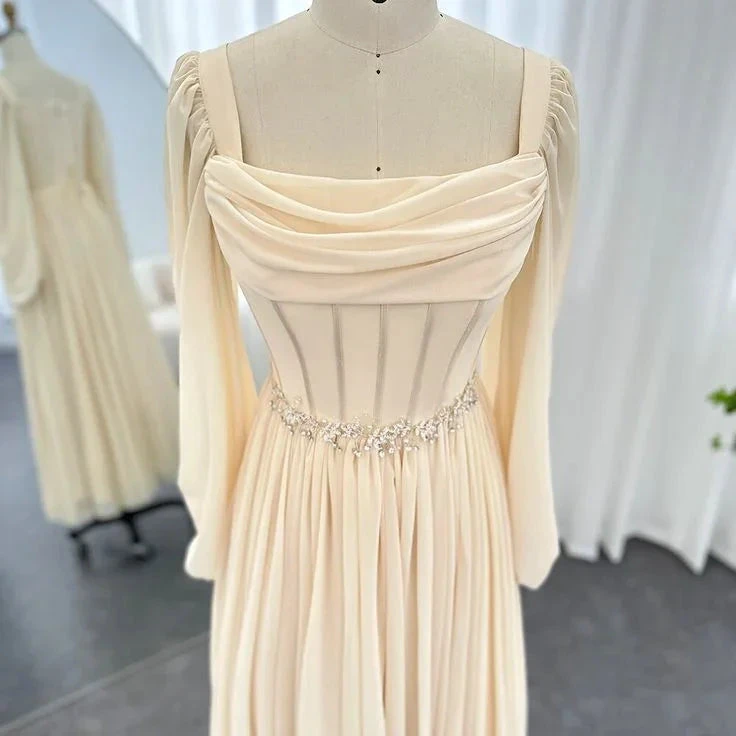 Elegant long cream dress with corset bodice and beaded waist, displayed at ZAPDRESS