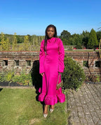 Woman in vibrant pink ruffle dress outdoors, stylish fashion look for ZAPDRESS homepage
