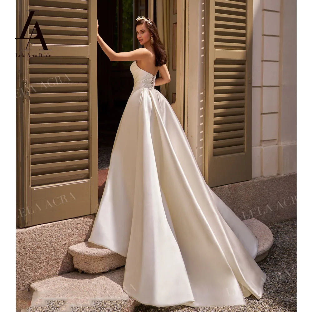 LelaAcra Sleeveless Satin A-Line Wedding Dress 2026 Sweetheart Backless Princess Bride Gown SM184 Plus Size Vestido De Noiva