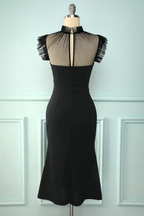 ZAPDRESS elegant black dress with mesh top and fringed sleeves on mannequin