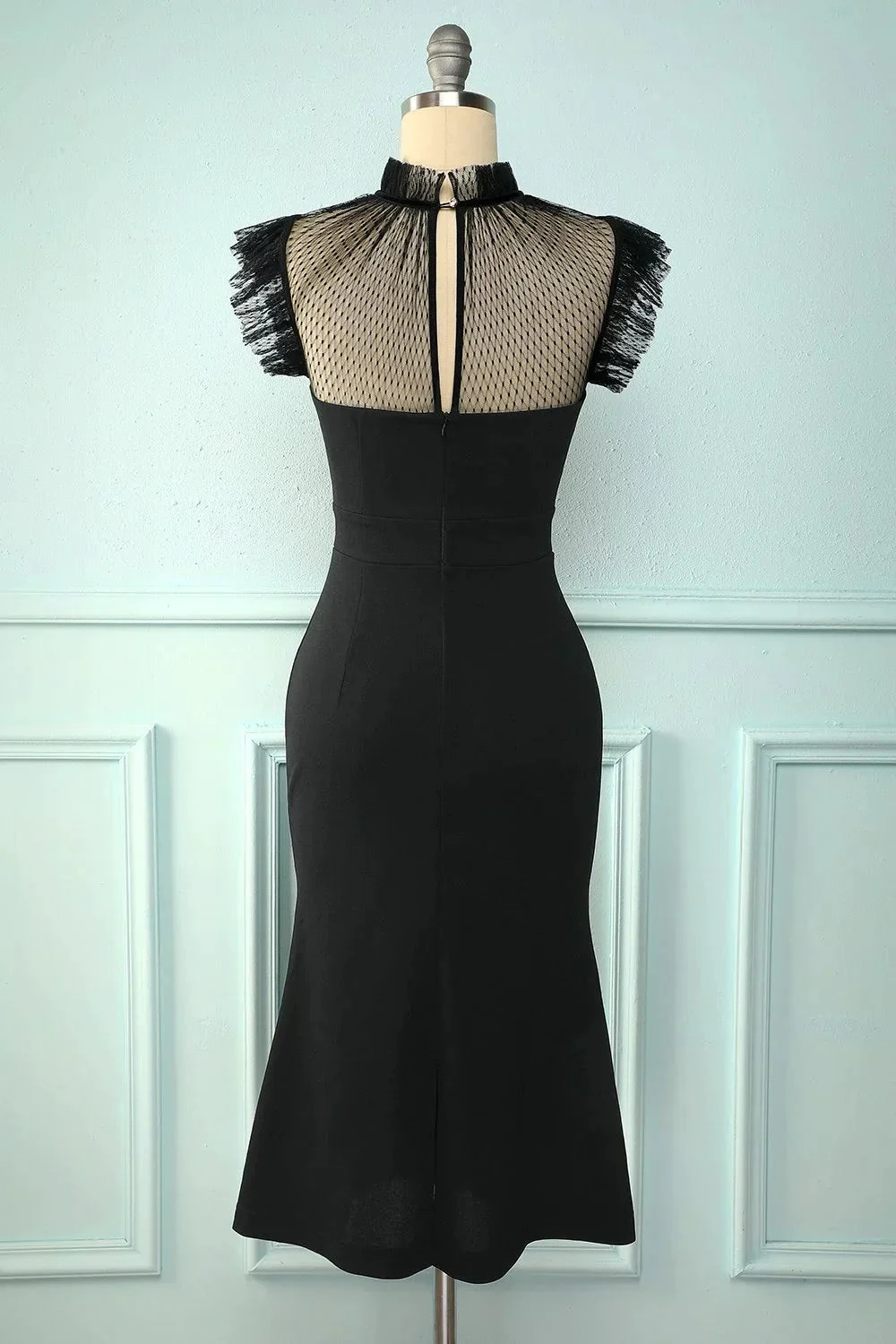 ZAPDRESS elegant black dress with mesh top and fringed sleeves on mannequin